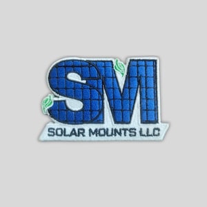 May include: Embroidered patch with the letters "SM" in blue, featuring a grid pattern and green leaf accents. The text "SOLAR MOUNTS LLC" is below the letters in white. The patch has a white border.