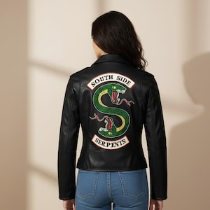 May include: Black leather jacket featuring a "South Side Serpents" patch on the back. The patch displays a green snake design with red accents and the words "South Side" and "Serpents" in white.