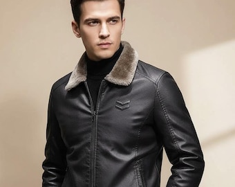 May include: A black leather jacket with a faux fur collar. The jacket has a zipper closure and a small emblem on the chest. The model is wearing a black turtleneck underneath. The jacket is a classic style.