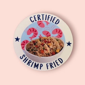 May include: A white round sticker with blue text that reads "Certified Shrimp Fried" and features a bowl of shrimp fried rice with a blue background and pink shrimp illustrations.