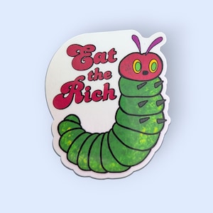 May include: A green and red caterpillar with a face and spikes on its back. The caterpillar is curled into a circle and the text "Eat the Rich" is written in red and white letters.