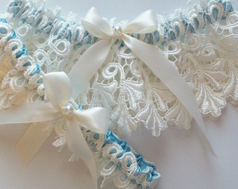 The JILLIAN Garter Set in Heirloom Ivory Venise Lace and Peek-a-Boo Blue Band with Ivory Satin Ribbon Bow Topped with a Pearl