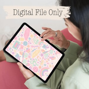 May include: A digital tablet displaying a pastel-colored pattern with various illustrations, including a rainbow, stars, and a cassette tape. The text "Digital File Only" is above the tablet. The tablet is held by a person wearing a green shirt.