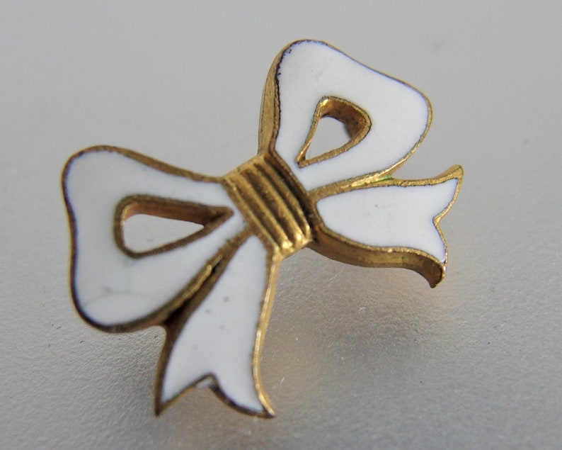 Antique White Enamel Bow Lapel Pin
