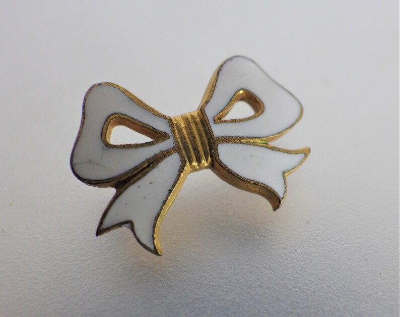 Antique White Enamel Bow Lapel Pin