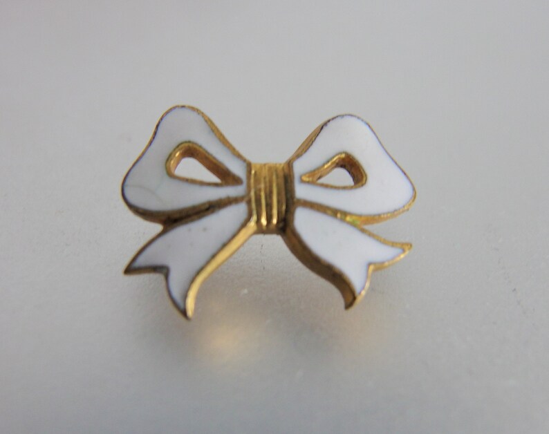 Antique White Enamel Bow Lapel Pin