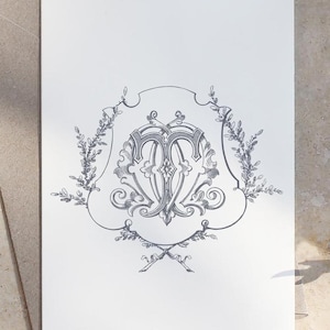 May include: A black and white illustration of a monogram with a decorative floral border. The monogram features the letters "T" and "M" intertwined.