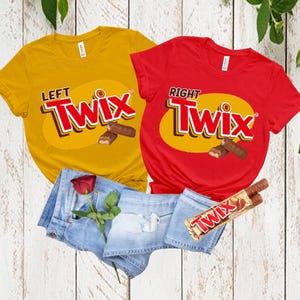 May include: A mustard yellow t-shirt with the text LEFT TWIX and a red t-shirt with the text RIGHT TWIX, both featuring a chocolate bar graphic. Included are light blue denim shorts, a single red rose, and a wrapped Twix chocolate bar.