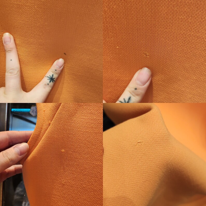 May include: Close-up of a fabric surface with a few small holes. The fabric is a solid orange colour.