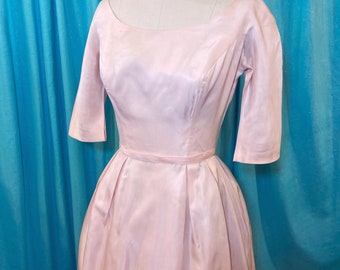 1950s/1960s W:23 pink satin short sleeve scoop neckline scoop back princess seam bow back fit and flare party dress