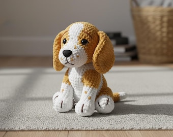 May include: A handmade crochet dog toy in a sitting position. The dog has a white and golden-yellow color scheme, with a black nose and dark eyes. The toy is sitting on a light gray rug, with a wooden floor in the foreground.