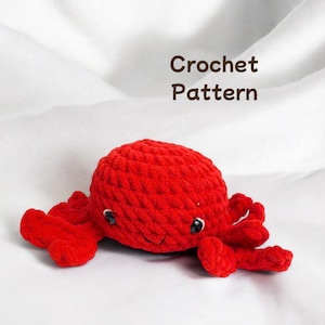 Handmade crocheted crab, amigurumi plushie, knitted crab toy, handmade amigurumi crab, soft crochet crab, handcrafted crab plush.