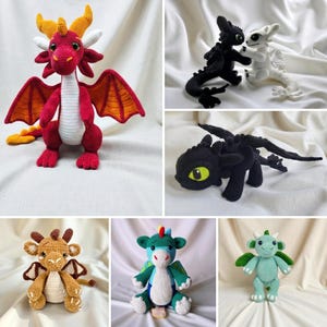 May include: A collection of six crocheted dragon plush toys in various colors including red, black, white, brown, green, and light blue. Each creature features distinct wings, horns, and facial details crafted with yarn, showcasing different poses.