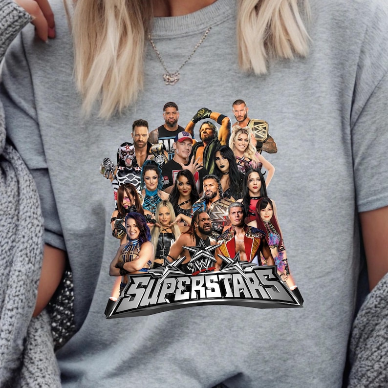 May include: Gray sweatshirt featuring a graphic of multiple WWE Superstars. The design includes the WWE logo and the word "SUPERSTARS" in a silver, metallic font. The image is a collage of various wrestlers.