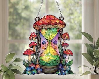 May include: A stained glass window hanging with a colorful hourglass design inside a mushroom. The hourglass is filled with glitter and surrounded by smaller mushrooms and flowers.