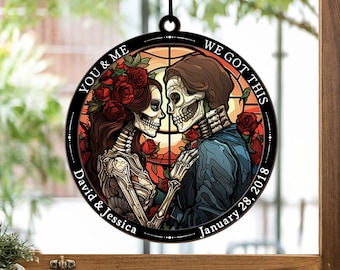 May include: A round stained glass window hanging with a couple of skeletons holding hands. The text reads "You & Me We Got This David & Jessica January 28, 2018".