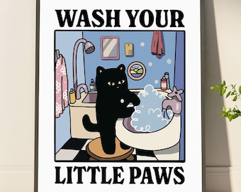 May include: A framed print featuring a black cat in a bathroom, washing its paws in a tub of bubbles. The text "WASH YOUR LITTLE PAWS" is displayed in bold, black letters above and below the image of the cat.