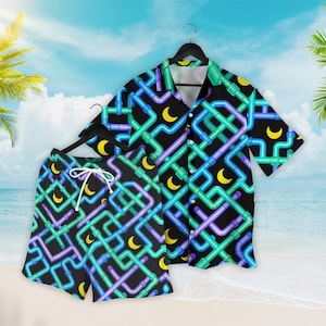 May include: A matching black button-down shirt and shorts set. The set features a repeating pattern of interconnected blue, green, and purple pipes with yellow crescent moons. The shirt is short-sleeved, and the shorts have a white drawstring.
