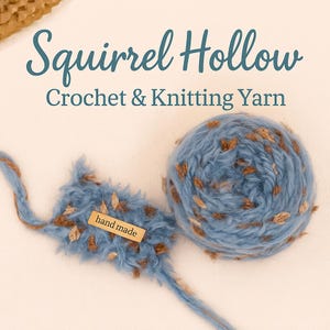 May include: A ball of blue and brown speckled yarn with a matching blue yarn tail and a small "hand made" tag. The text "Squirrel Hollow Crochet & Knitting Yarn" is displayed in teal.