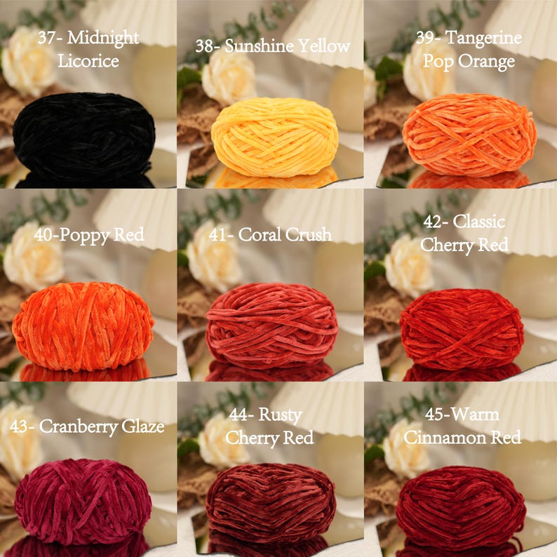 May include: Nine skeins of yarn in various colors, including black, yellow, orange, and red. Each skein is labeled with a color name and number. The yarn is arranged on a reflective surface, with a soft, textured appearance.