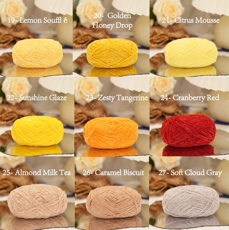 May include: Nine skeins of yarn in various colors, including yellow, orange, red, beige, and gray. Each skein is labeled with a color name, such as "Lemon Souffl&eacute;," "Golden Honey Drop," and "Cranberry Red."