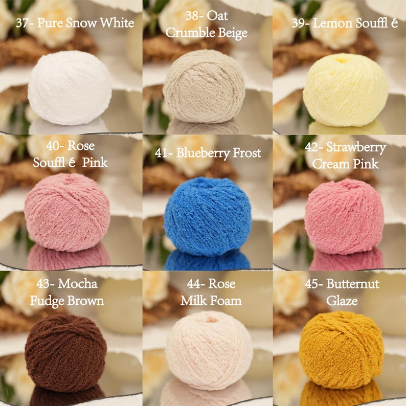 May include: A selection of colourful yarn balls, each labelled with a number and colour name. Shades include white, beige, yellow, pink, blue, brown, and gold, with names like "Pure Snow White" and "Lemon Souffl&eacute;".