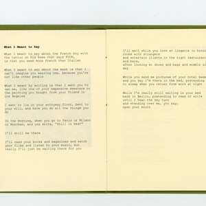 May include: A page from a book with handwritten text in black ink on a cream-coloured background. The text is a poem about a relationship and the feelings of love and longing. The text includes the phrases "What I Meant to Say" and "I'll still be there".