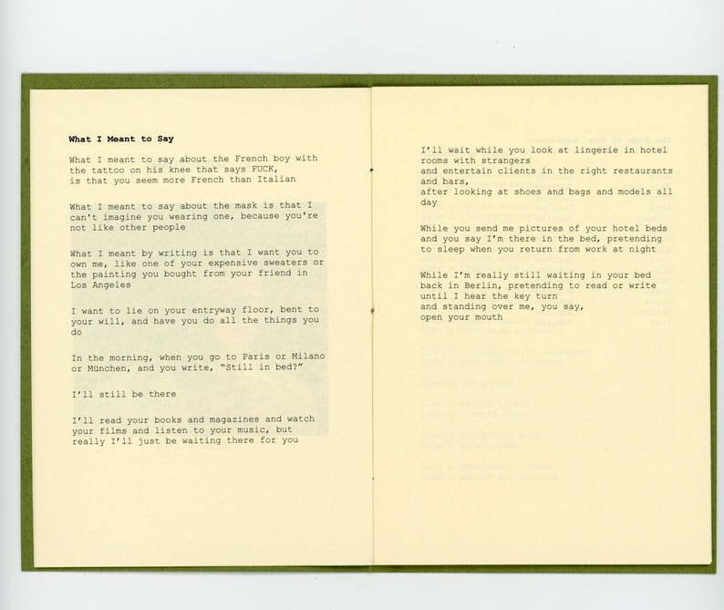May include: A page from a book with handwritten text in black ink on a cream-coloured background. The text is a poem about a relationship and the feelings of love and longing. The text includes the phrases "What I Meant to Say" and "I'll still be there".