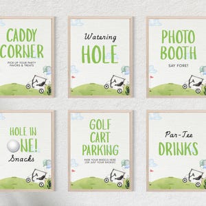 May include: Six framed signs with golf-themed text in green. The signs read "Caddy Corner," "Watering Hole," "Photo Booth," "Hole in One! Snacks," "Golf Cart Parking," and "Par-Tee Drinks." Each sign features a golf cart illustration.