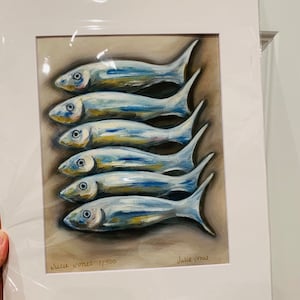 May include: A framed painting of six silver fish in a row, painted in a realistic style with blue and yellow hues. The painting is signed "Julie Jones 1/500" in the bottom left corner and "Julie Jones" in the bottom right corner.