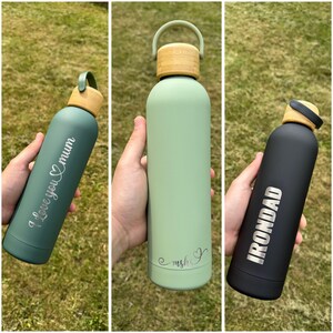 Three personalised reusable water bottles with bamboo lids – engraved with ‘I Love You Mum’, initials, and ‘IRONDAD’ – ideal custom gift for mums, dads, and loved ones.