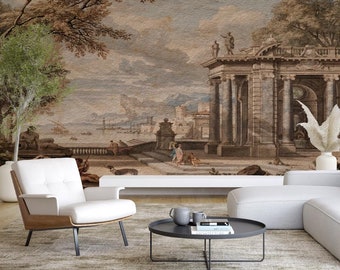 May include: A living room interior with a white sectional sofa, a white armchair, and a black coffee table. The wall behind the furniture features a large mural depicting a classical landscape with a building and trees.