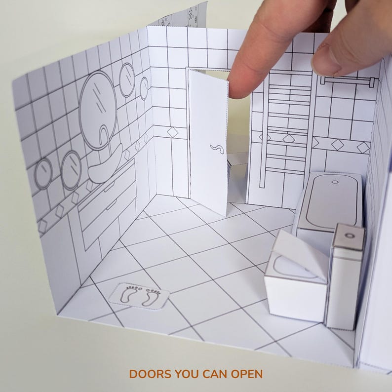 May include: A paper craft model of a bathroom interior with black and white line art. The scene features a tiled floor, a sink, a bathtub, a toilet, and a door that can be opened. The text DOORS YOU CAN OPEN is printed at the bottom.