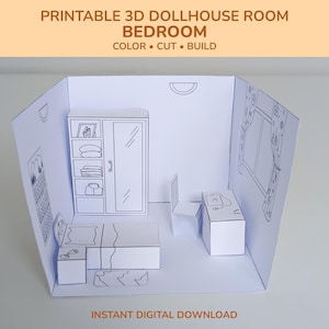 May include: A printable 3D dollhouse bedroom scene. The white paper model includes a bed, wardrobe, desk, and chair. The text at the top reads "PRINTABLE 3D DOLLHOUSE ROOM BEDROOM COLOR • CUT • BUILD". The bottom text says "INSTANT DIGITAL DOWNLOAD".