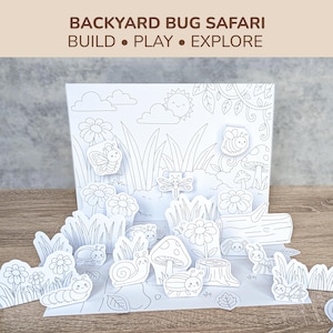 Puede incluir: Un set de manualidades Backyard Bug Safari con el texto BUILD PLAY EXPLORE. El conjunto presenta un fondo blanco con dibujos de líneas negras de un sol, nubes y follaje, acompañado de varios insectos de papel recortados como caracol y abeja.