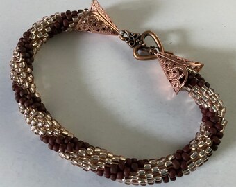 Amber and burnt plum crochet beaded bangle with rose gold heart finish