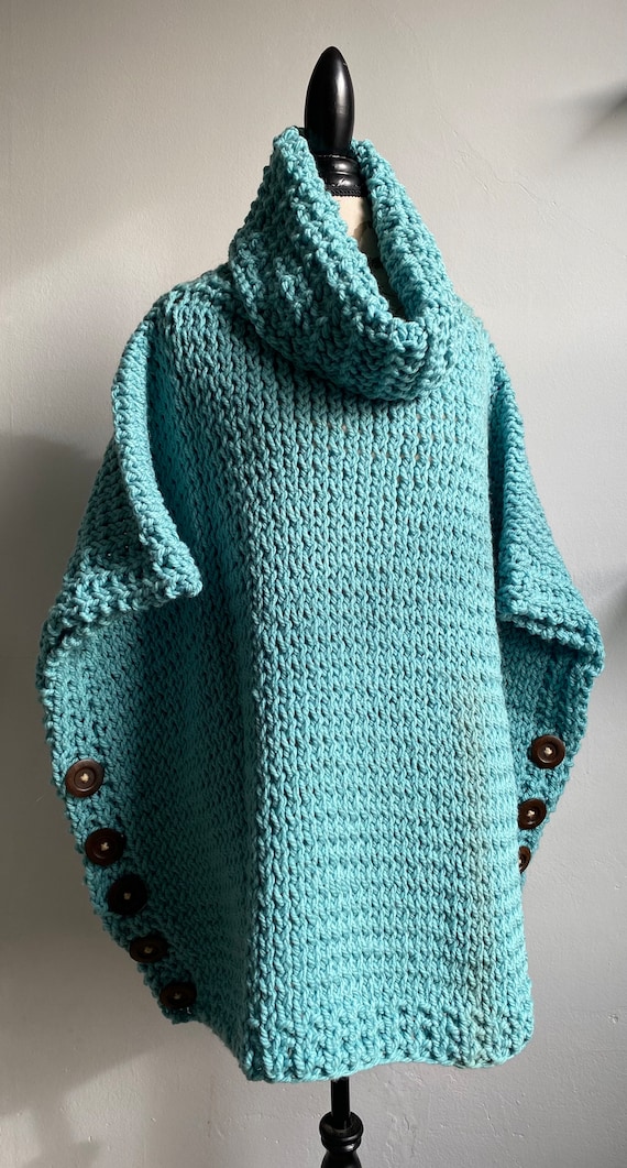 Pullover wide sleeve hand knit poncho sweater in soft teal with dark stained wood button accents