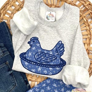 Hen on Nest using Ash sweatshirt, Fabric C, and Navy thread.