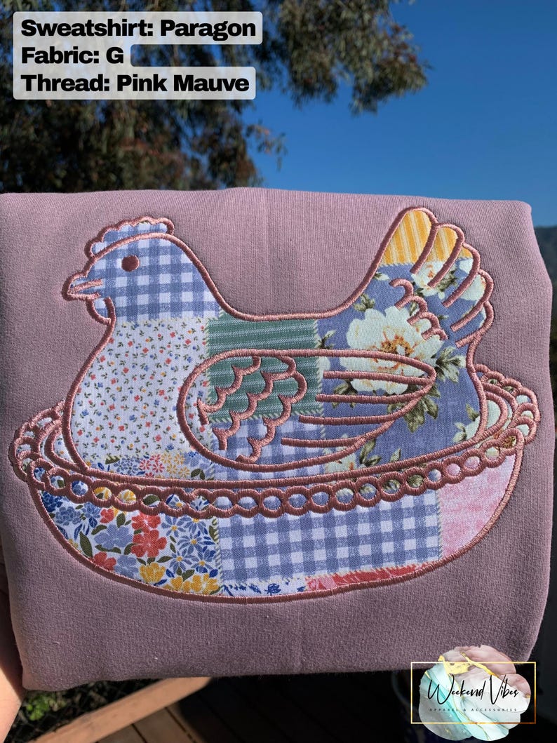 Embroidered Hen on Nest sweatshirt on a Paragon sweatshirt with Fabric G and Mauve thread.