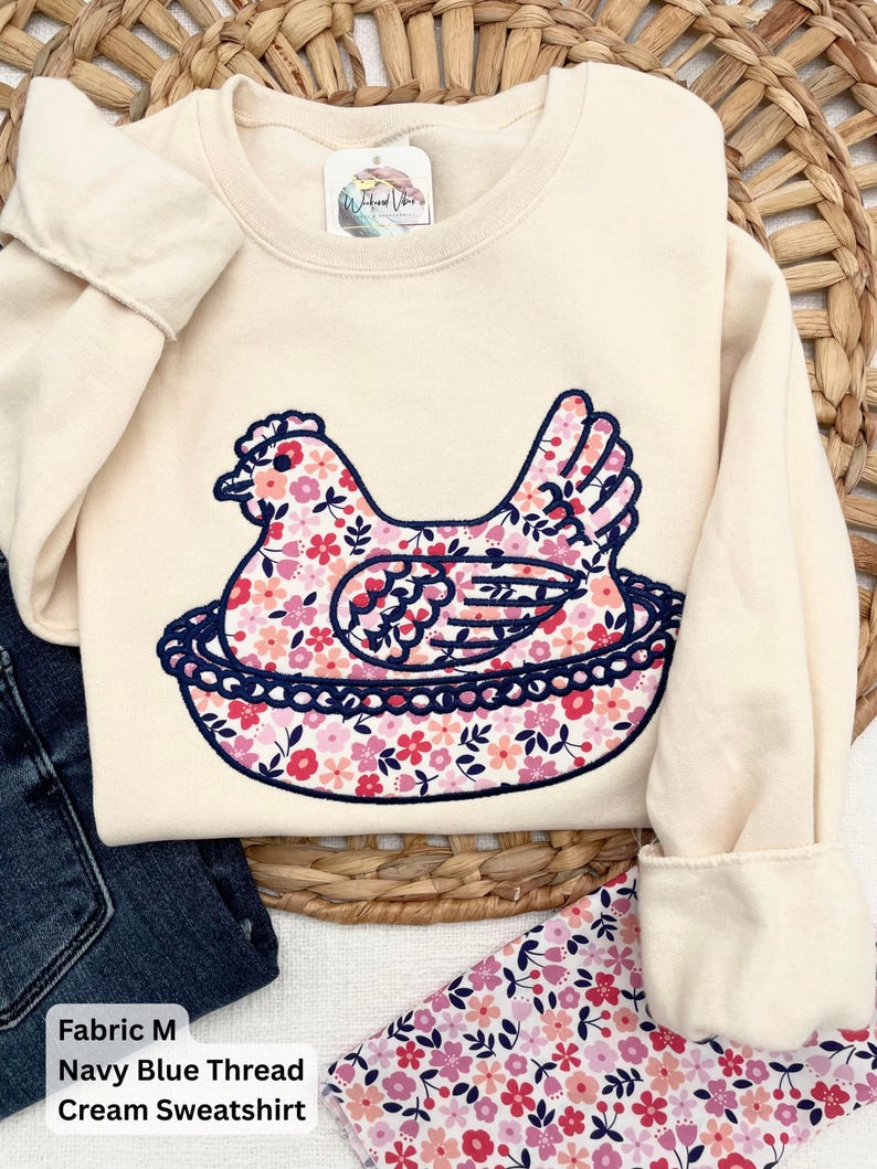Hen on Nest using a Cream sweatshirt, Fabric M, and Navy blue thread.