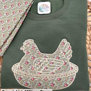 Hen on Nest sweatshirt using Military Green sweatshirt, Fabric P, and cornsilk thread.