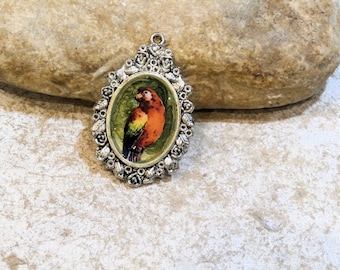 baroque boho parrot frame pendant, hand painted silver metal, green and orange, artisanal supply for jewelry creation
