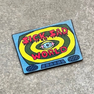 May include: A blue and yellow television screen with a red and yellow eye and the text "Sick Sad World" in red dripping letters.