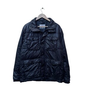 May include: Black quilted jacket with multiple pockets and a button-up front. The jacket has a high collar and is hanging on a wooden hanger. The jacket appears to be made of a shiny, water-resistant material.