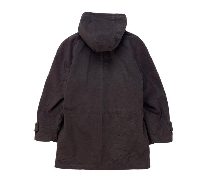 May include: A dark brown hooded jacket with a zipper closure and a long length. The jacket has a relaxed fit and a casual style.
