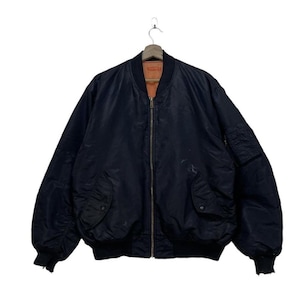 May include: A black bomber jacket with a zip fastening. The jacket has a ribbed collar and cuffs.