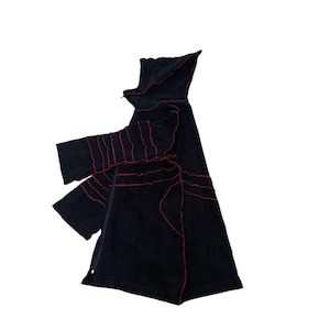 May include: Black hooded cloak with red stitching details. The cloak has long sleeves and a full-length zip. The red stitching creates a unique, artistic design. The cloak is made of a soft, dark fabric.