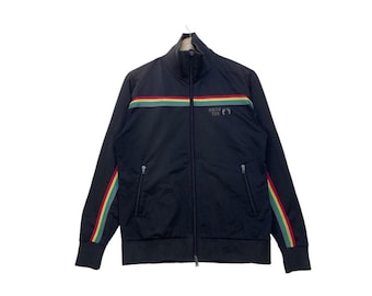 May include: Black zippered jacket with a rainbow stripe across the chest and the words "Hope" and "Trust" in grey lettering.