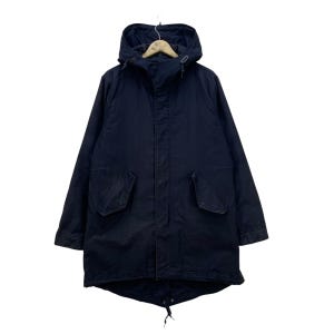 May include: A dark blue hooded parka with a drawstring waist and two large pockets. The parka has a zipper closure and a flap over the zipper.