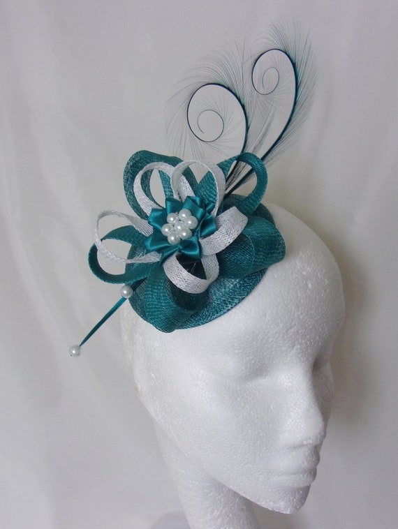 suitable for races, Green net and feather hair fascinator on a slim alice band